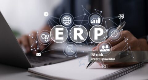 An IT manager studies ERP (Enterprise Resource Planning) architecture.